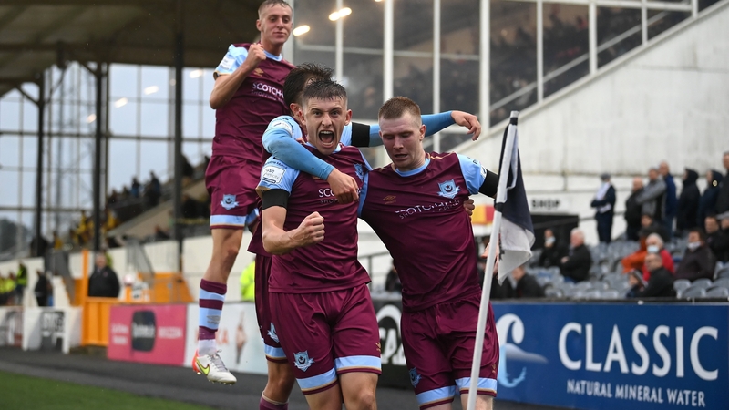 Mark Doyle (R), celebrates with Drogheda United team-mates Jake Hyland (L), Darragh Markey (hidden) Killian Phillips