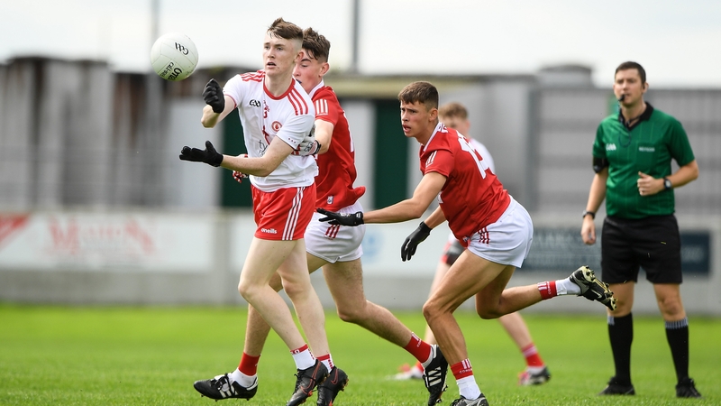 Ronan Fox of Tyrone in action against Colm Gillespie and Hugh O'Connor of Cork