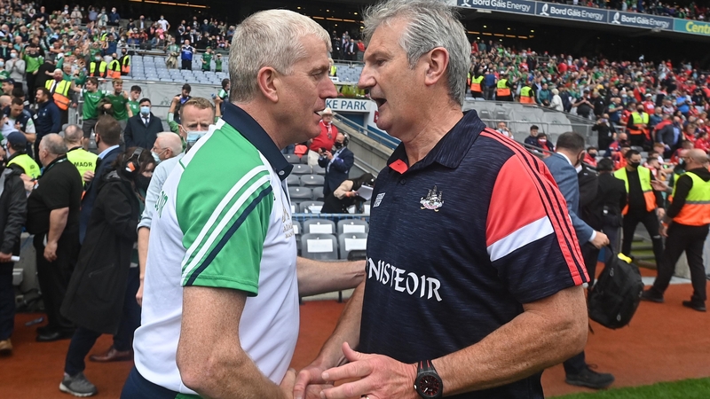 Kieran Kingston (R) congratulates John Kiely after the hurling final