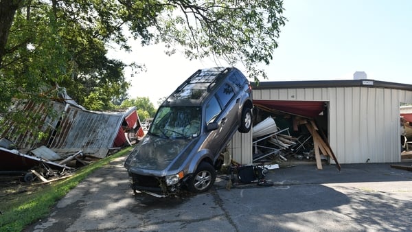 Cars were flipped over due to the force of the flooding in Waverly