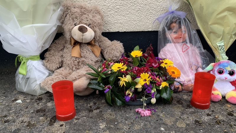 Flowers and teddy bears were left outside the family's home in Galway