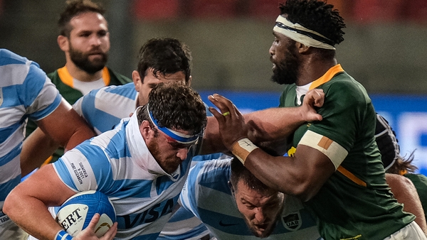 Argentina's hooker and captain Julian Montoya (L) is tackled by South Africa's blindside flanker and captain Siya Kolisi (R) on Saturday