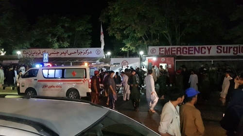 Injured people being carried to a hospital in Kabul