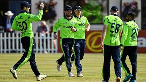 Andrew Balbirnie is congratulated by team-mates after catching Zimbabwe's Craig Ervine