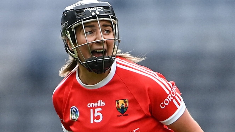 Linda Collins celebrates after scoring the winning point