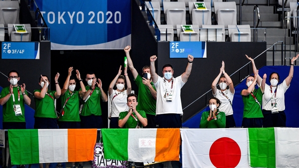Members of Team Ireland cheer on Nicole Turner