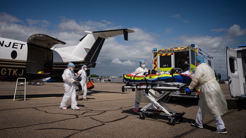 Medical staff take care of a Covid-19 patient who was transferred from the Marseille area to Strasbourg airport in eastern France