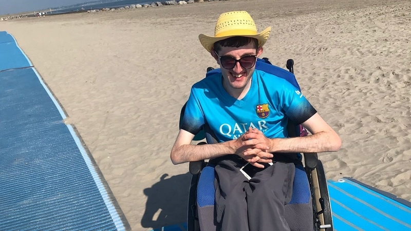 Patrick Greville using the new beach mats for wheelchair and scooter users at Dollymount strand (Pics: Dublin City Council)