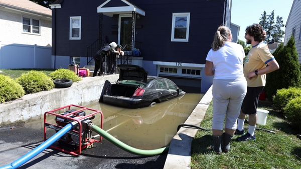 A car outside a flooded garage in Mamaroneck, New York