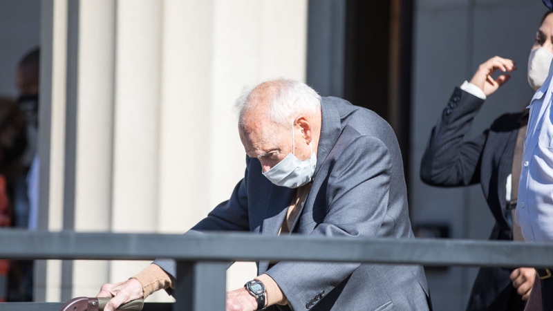 Theodore McCarrick leaves the courthouse after entering his not guilty plea