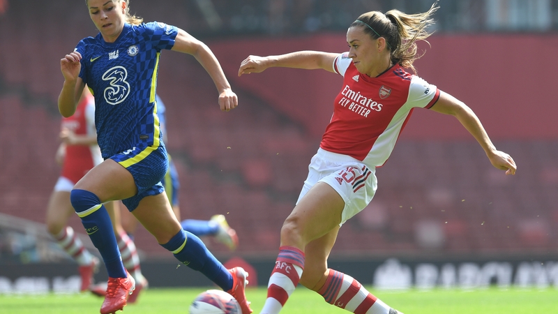 Katie McCabe works the ball past Chelsea's Melanie Leupolz