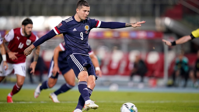 Lyndon Dykes slots home from the penalty spot