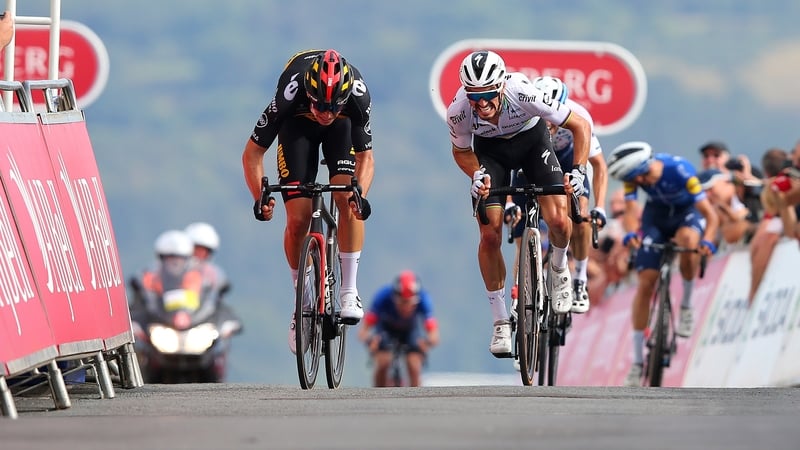 Wout van Aert and Julian Alaphilippe grimace as they pedal through the pain barrier in an uphill sprint finish