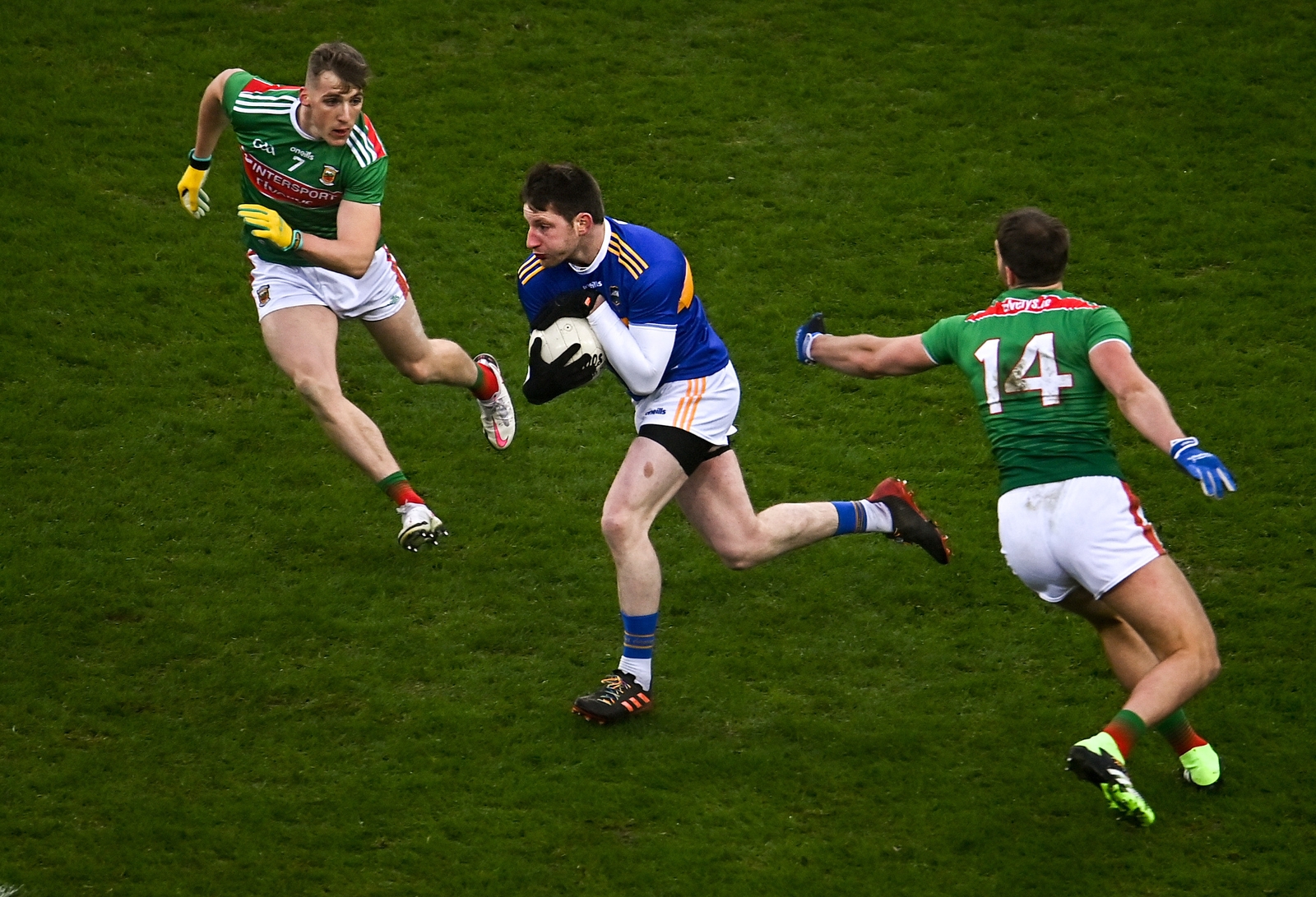 Tipp's Jimmy Feehan bursts past Eoghan McLaughlin and Aidan O'Shea during the 2020 semi-final