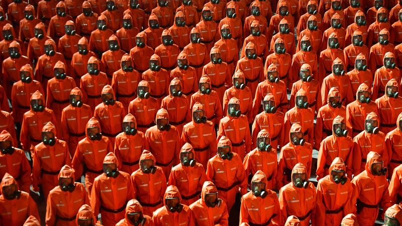 Members of the Worker-Peasant Red Guards wore hazmat suits at the parade in Pyongyang