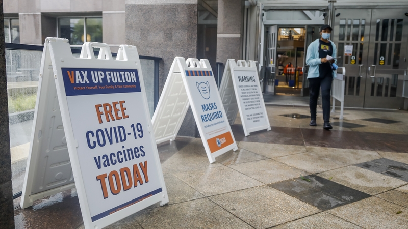 Signs announce the Fulton County Board of Health operates a Covid-19 vaccine clinic at the Government Building in Atlanta
