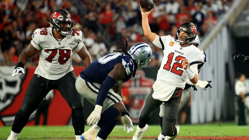 Tom Brady (12) gets a pass away