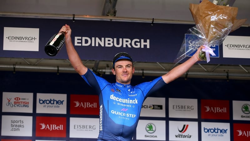 Yves Lampaert celebrates on the podium