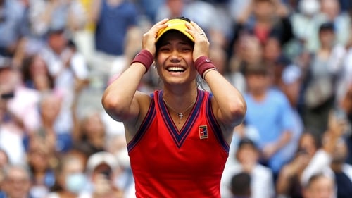 Emma Raducanu celebrates winning match point