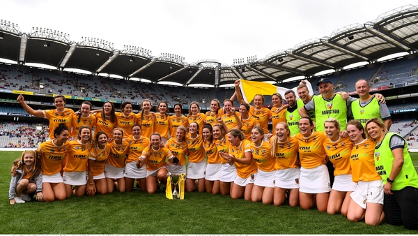 Antrim players and management rejoice on the Croke Park turf