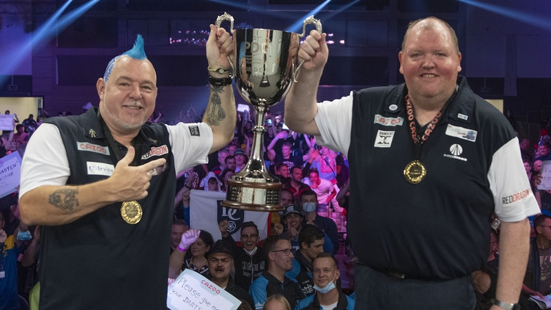 Peter Wright and John Henderson celebrate their victory. Credit: Kais Bodensieck/PDC Europe