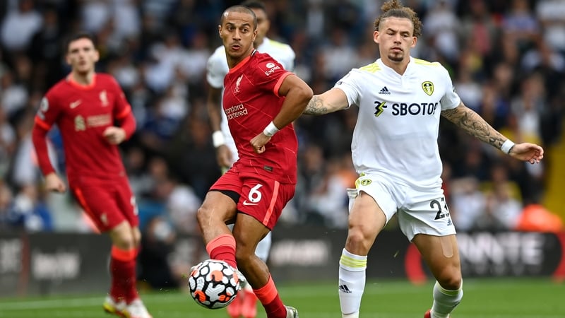 Thiago Alcantara gets a pass away despite pressure from Kalvin Phillips