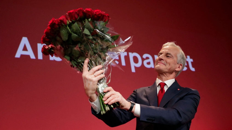 Jonas Gahr Støre holds a bouquet of red roses after the results of the Labour Party's election event in Oslo