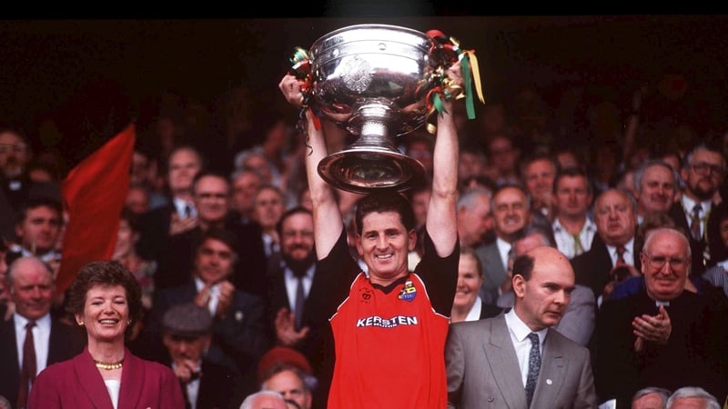 Down captain Paddy O'Rourke raises the Sam Maguire aloft after their 1991 final win over Meath