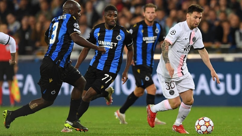 Lionel Messi (R) was unable to help PSG beat the Belgians