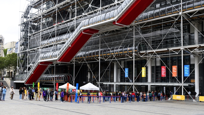 Visitors queue to have their Covid-19 health passes checked before entering the George Pompidou Centre in Paris