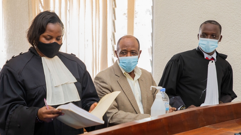 Paul Rusesabagina pictured with his lawyers during the trial