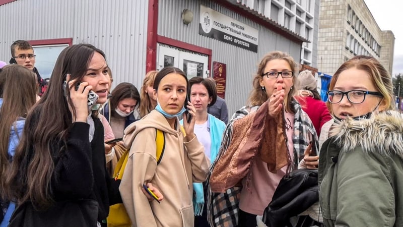 Students evacuate a building of the Perm State University campus