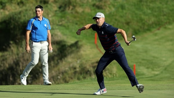 Justin Thomas celebrates a putt during the afternoon fourballs