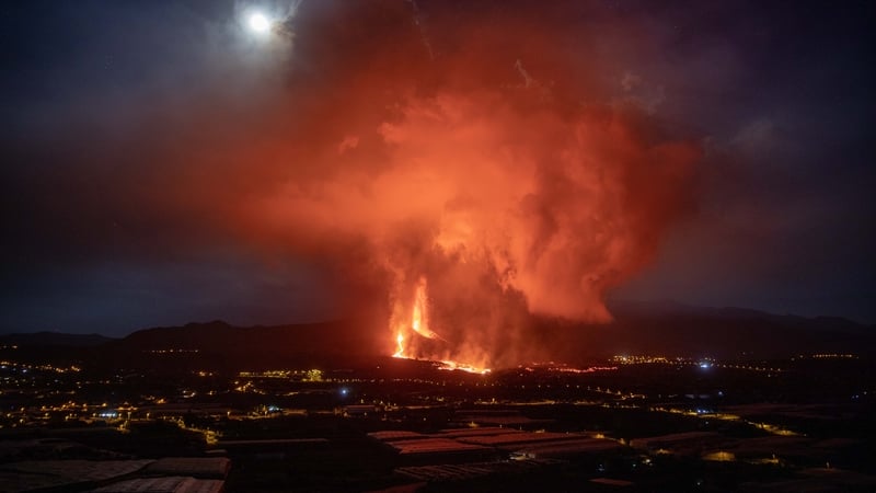 Lava and smoke rise from the Cumbre Vieja volcano on La Palma