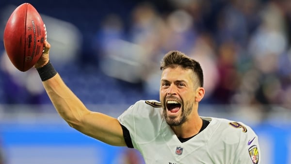 Justin Tucker celebrates after making the winning kick