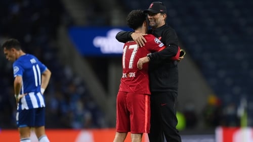 Curtis Jones and Jurgen Klopp embrace after the final whistle