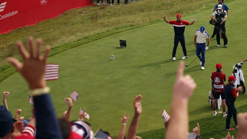 Bryson DeChambeau on the first tee of his singles match with Sergio Garcia interacting with the crowd