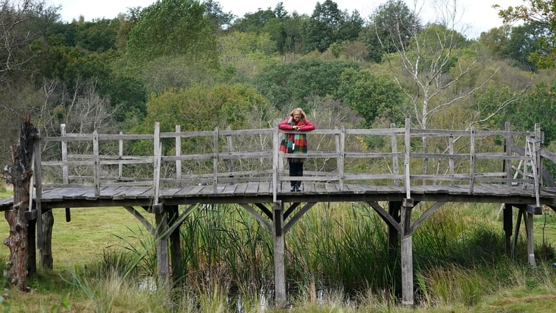 Silke Lohmann of Summers Place Auctions stands on the original Poohsticks Bridge from Ashdown Forest