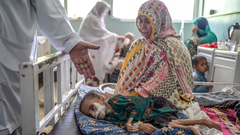 A child reportedly suffering from malnutrition receives treatment at the Mirwais hospital in Kandahar