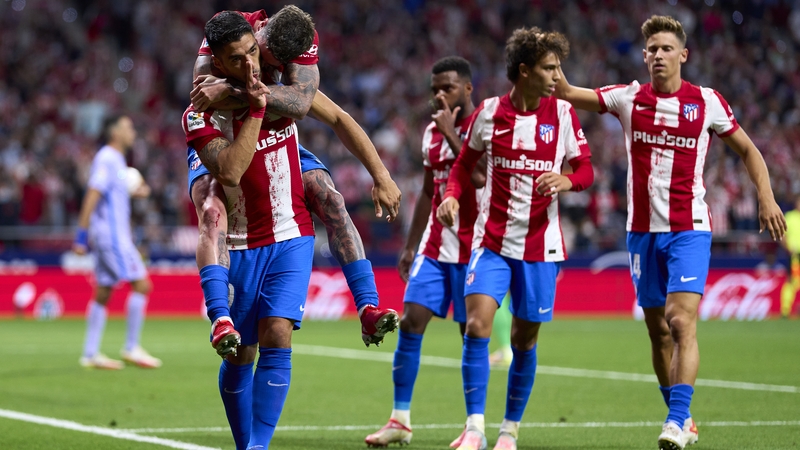 Luis Suarez celebrates scoring against his former team