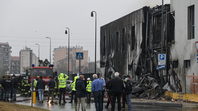 A view of the area where a small airplane crashed into a building as all 8 onboard died in San Donato, Milan