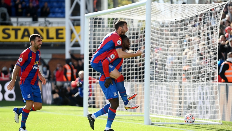 Jeffrey Schlupp of Crystal Palace celebrates with teammate Joel Ward