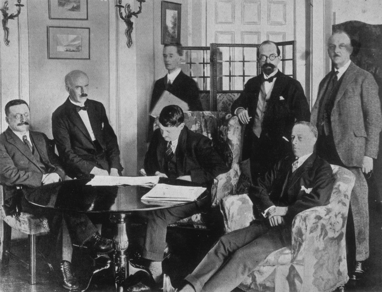 This photo is claimed to capture the moment the Irish delegates began signing the treaty (Credit: Getty Images)