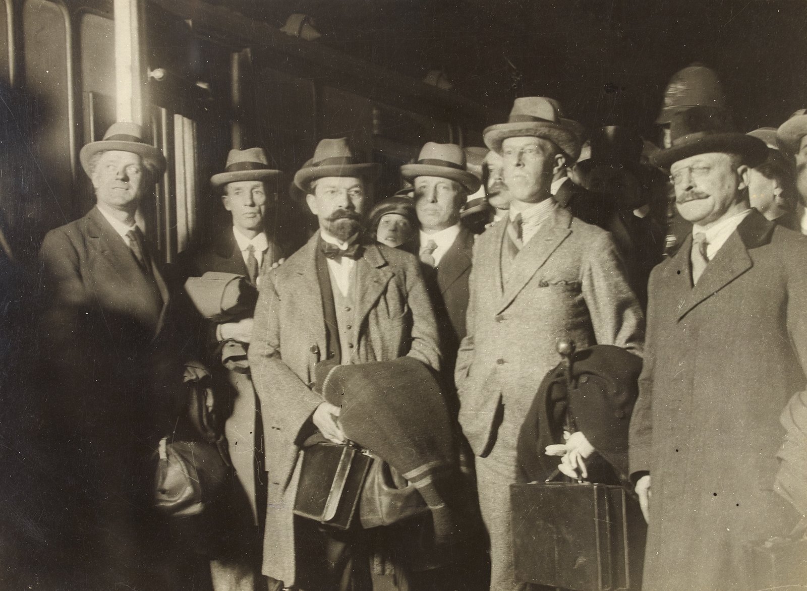 INTO THE STORM: Negotiators George Gavan Duffy, Robert Barton and Arthur Griffith, with chief secretary Erskine Childers returning to Dublin after the signing (Credit: National Library of Ireland)
