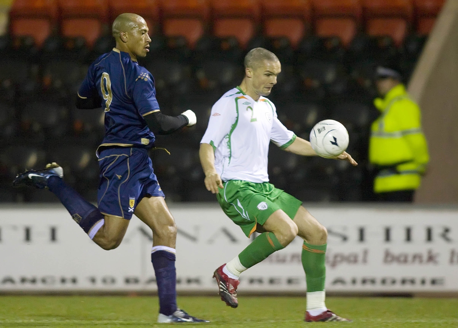 Goodwin is chased down by Scotland debutant Chris Iwelumo during the 2007 B international
