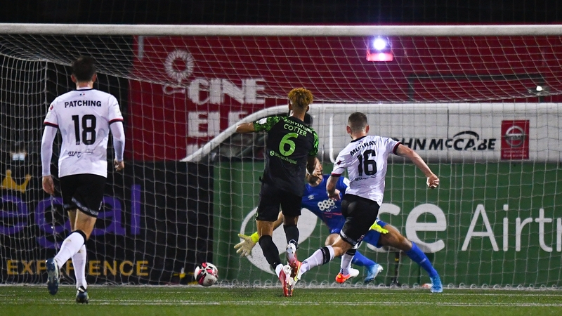 Sean Murray slides home the winner