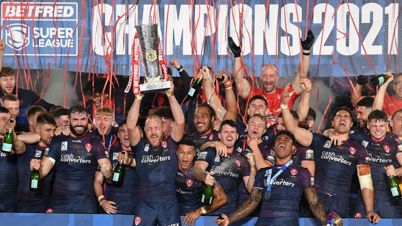 St Helens captain James Roby lifts the Super League trophy