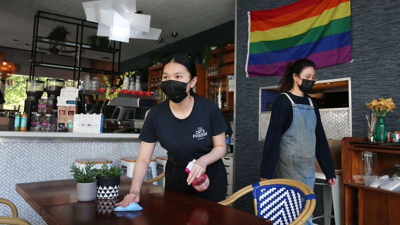 Elaine Stephanie and Oranith Phattrapanee prepare to welcome back seated patrons at The Pelican Hills cafe in Surry Hills, Sydney