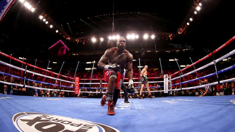 Tyson Fury knocks down Deontay Wilder in the third round during their WBC heavyweight championship