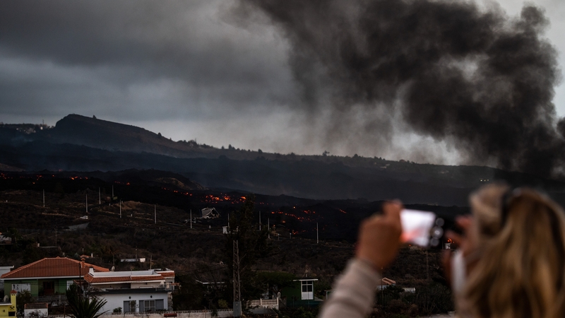 A stream of red-hot lava gushing from the Cumbre Vieja volcano engulfed a cement plant